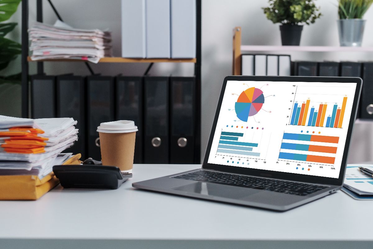 Laptop displaying analytics charts for measuring online visibility and traffic