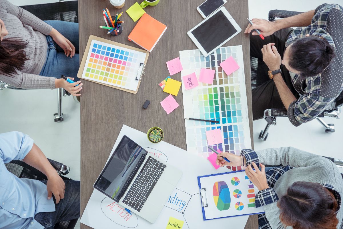 Marketing team reviewing content strategy and campaign visuals