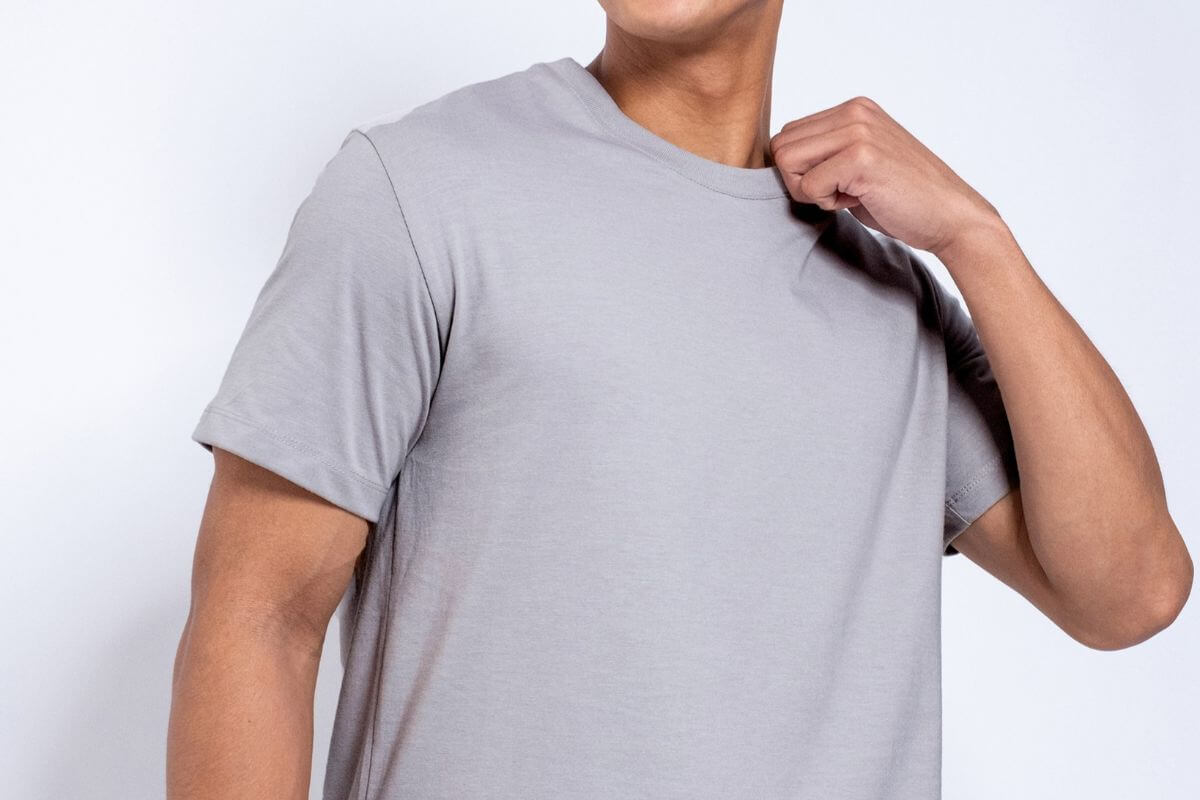Man wearing a plain gray Lifeline shirt, featuring comfortable everyday style with a clean and versatile look.