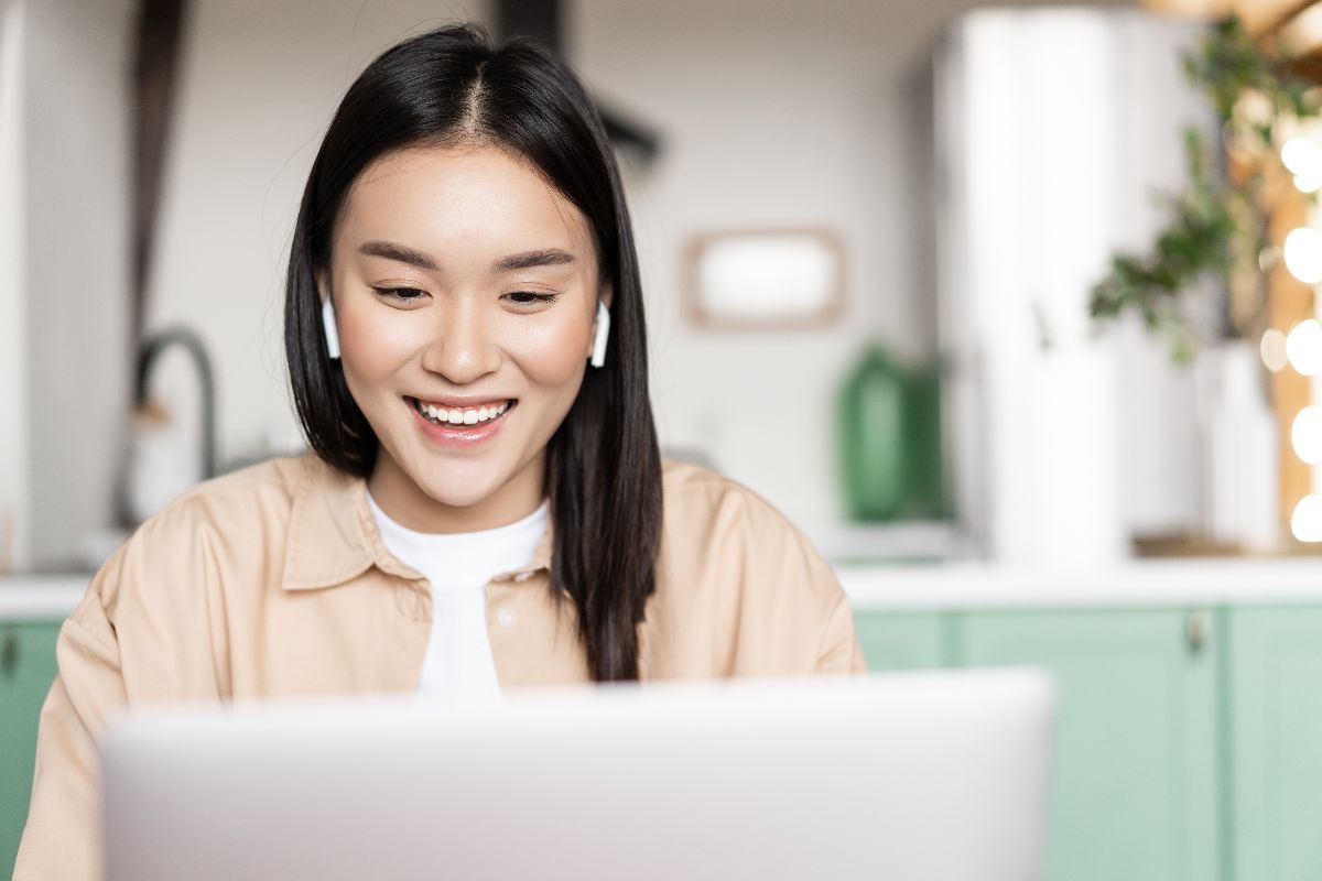 Remote social media virtual assistant working on a laptop at home