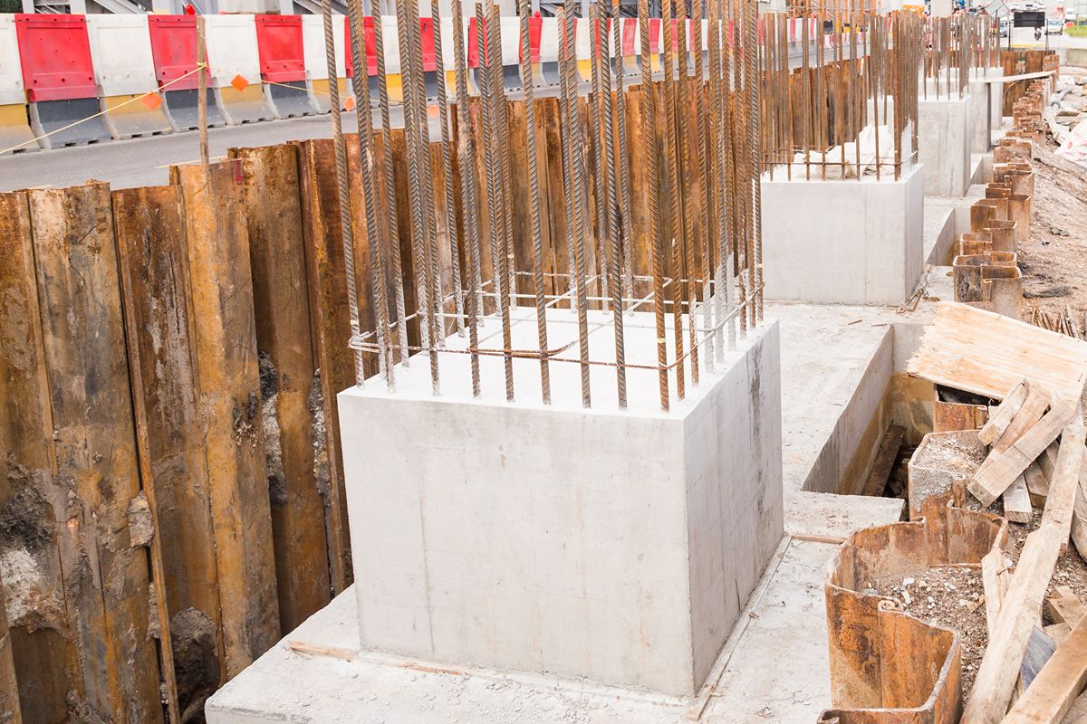 Steel sheet pile wall supporting soil retention for foundation construction
